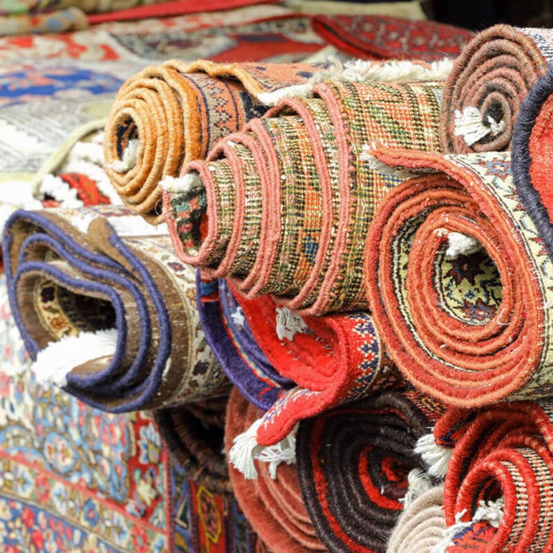 Stacked colorful rugs