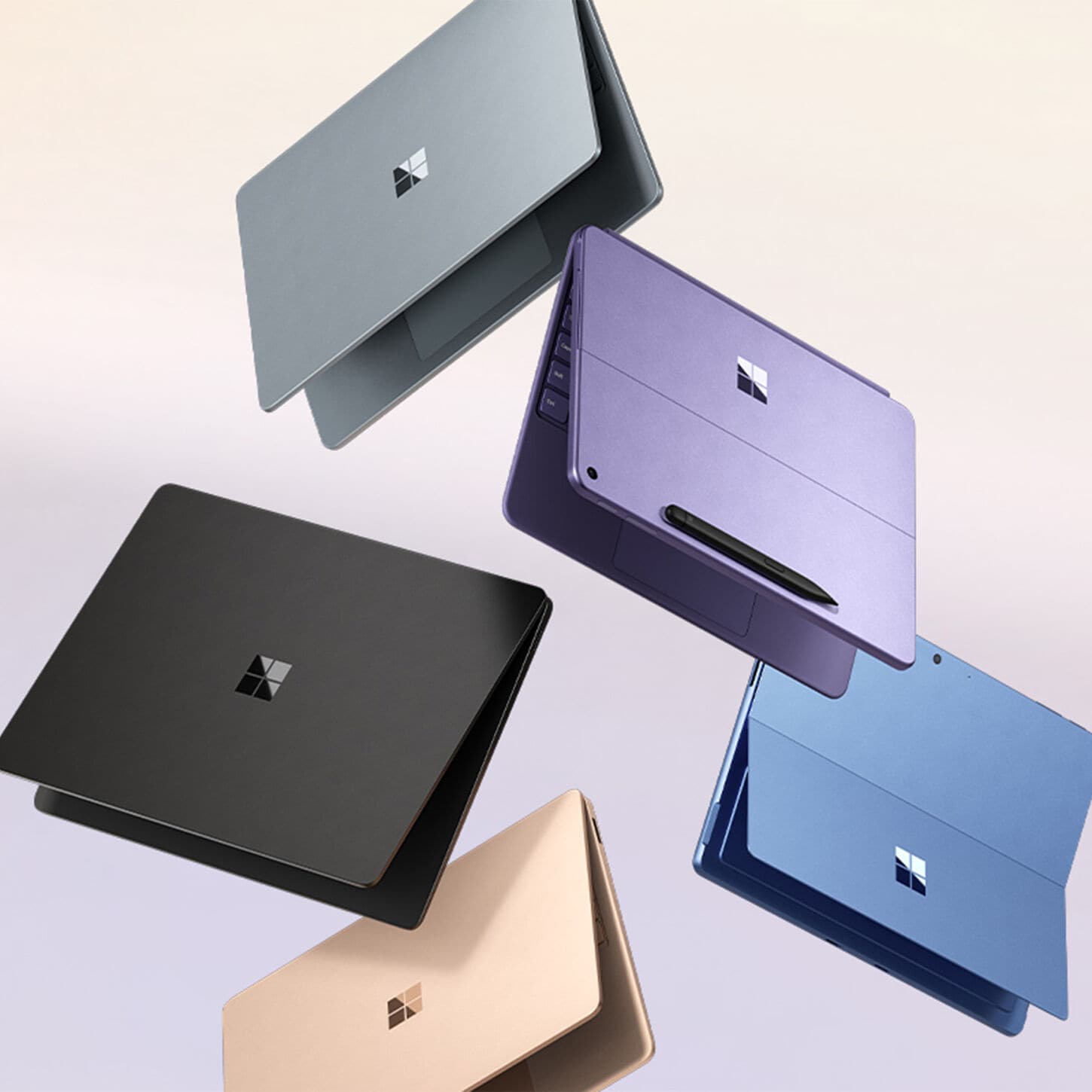 4 Surface Copilot+ PCs on beige background