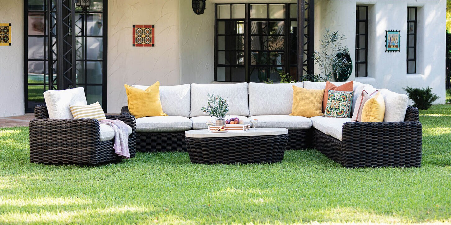Outdoor patio furniture with lots of pillows on the sectional