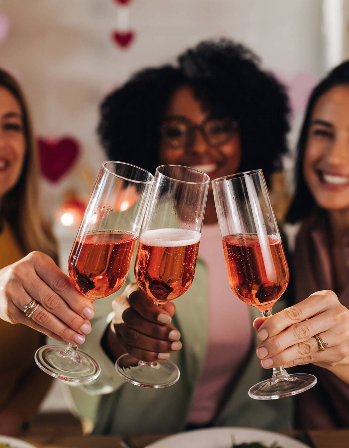3 women cheersing their glasses of champagne