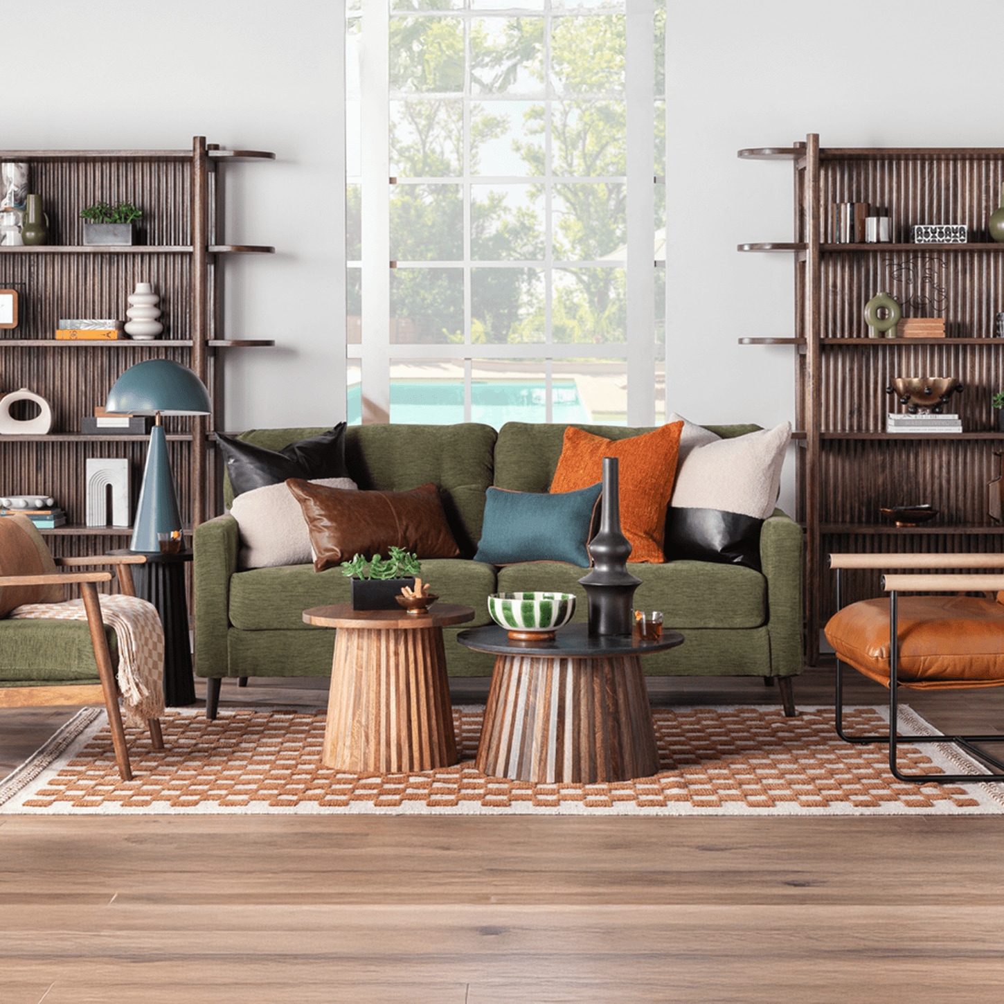 Living Room scene with green couch and accent chairs