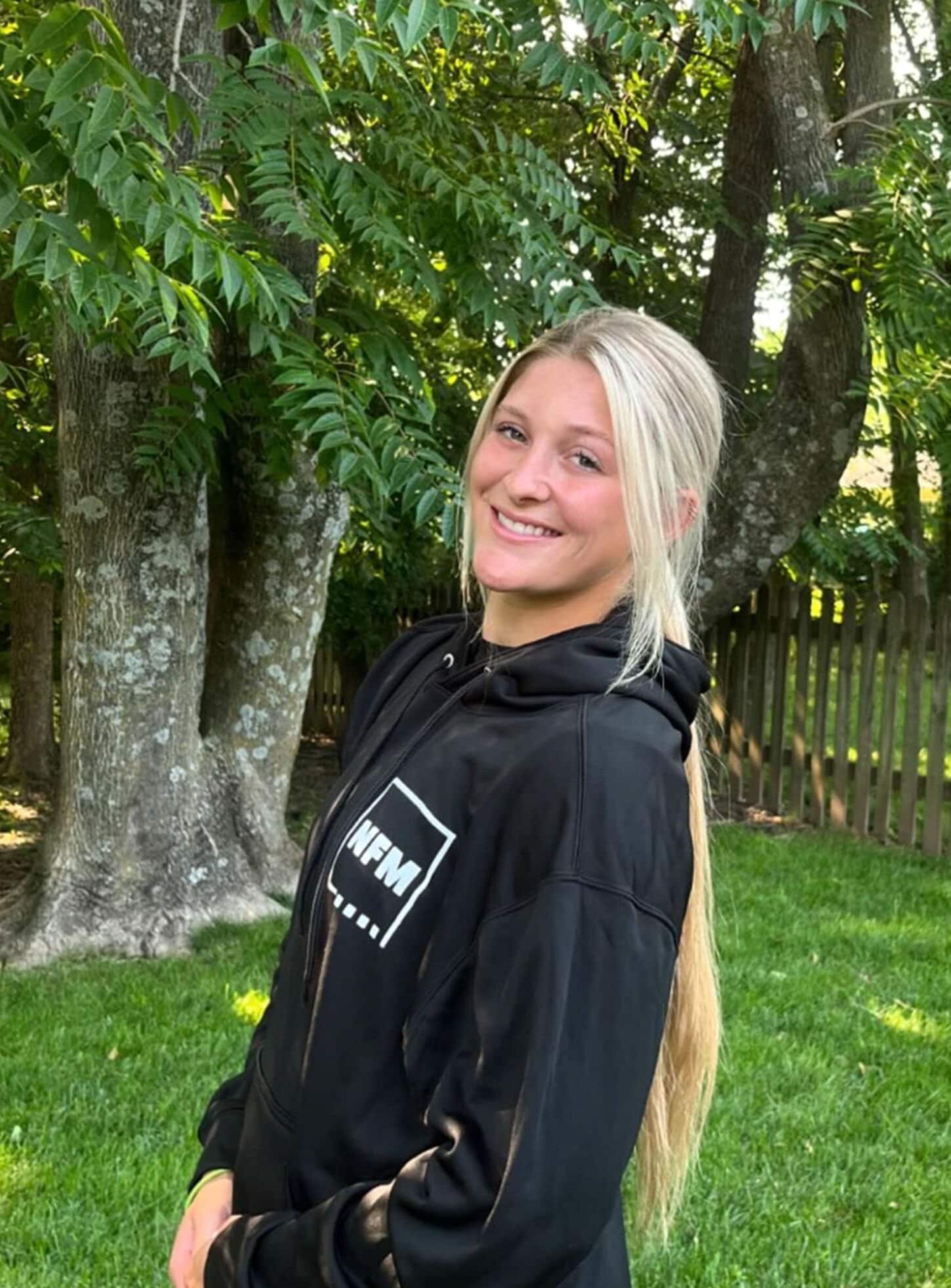 Home Team athlete posing for picture for welcome box