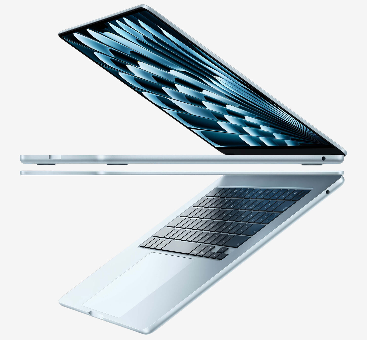 Two Apple MacBook Airs open facing opposite directions