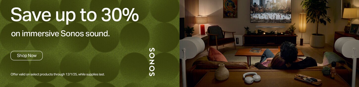 couple watching tv surrounded by sonos audio