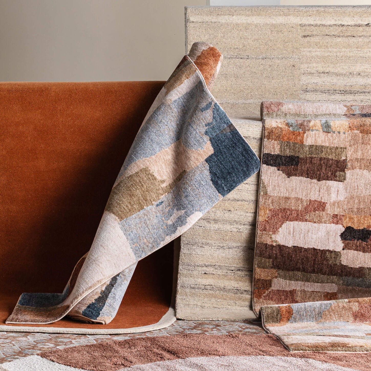 Area rugs piled together