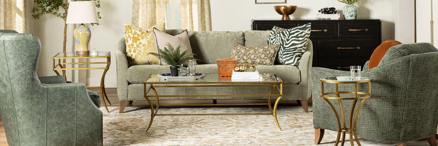Living room with green sofa and two accent chairs.