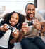 A father and daughter gaming together intensely