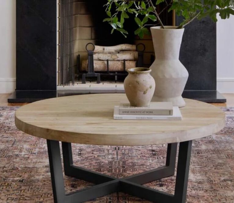 Living room with warm neutral tones and new rug centered in room from the Chris loves Julia-Loloi collection.