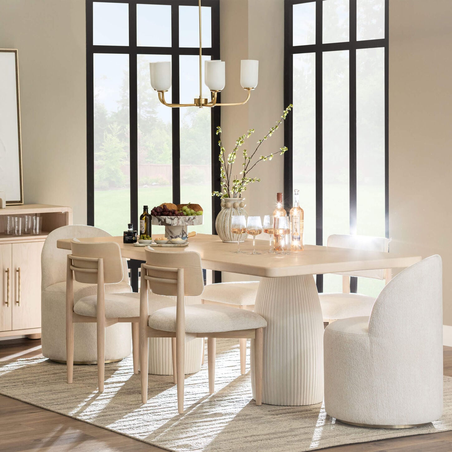 Light wood dining set in bright room with tan walls