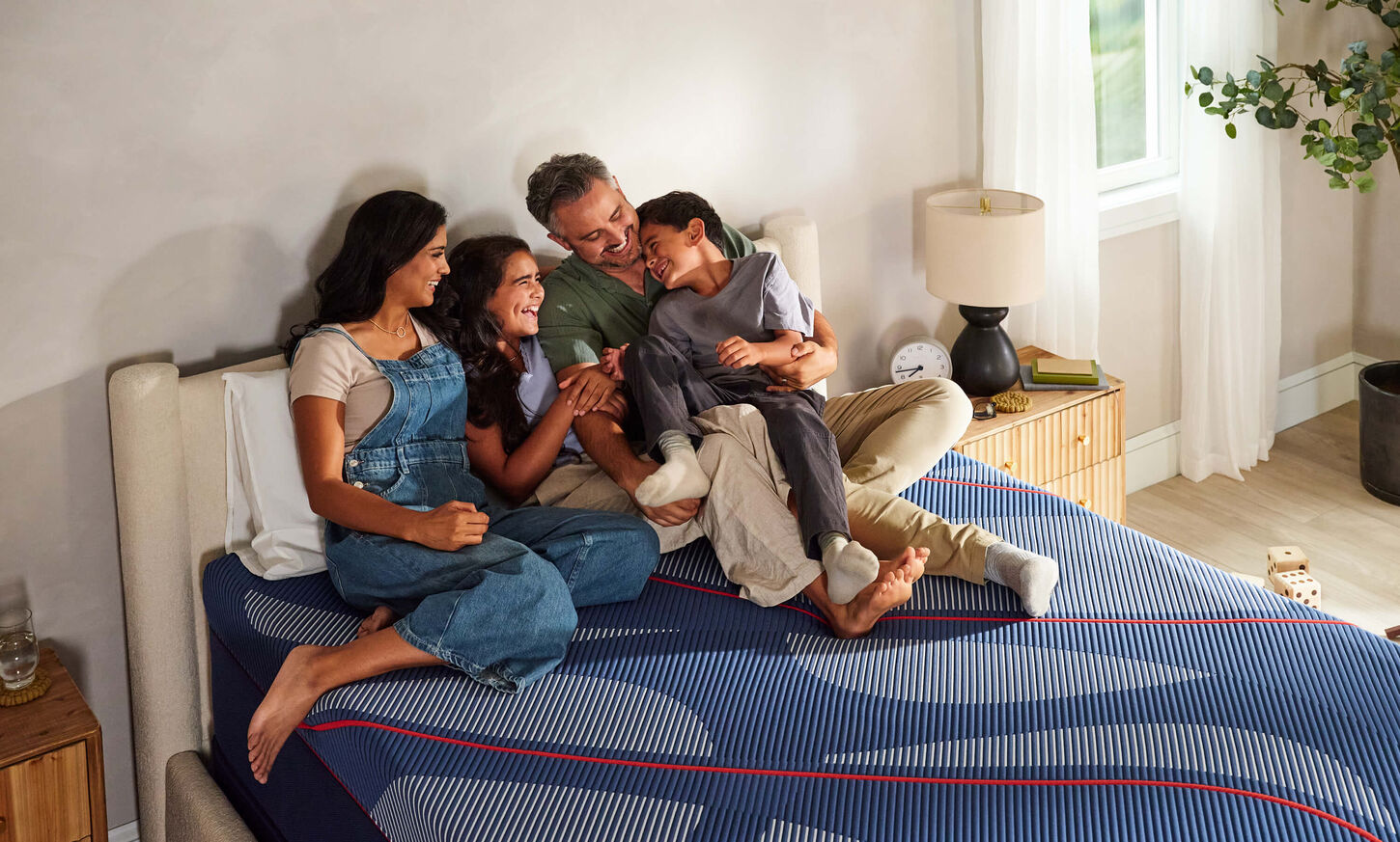 Family Laughing Together on Sealy Mattress