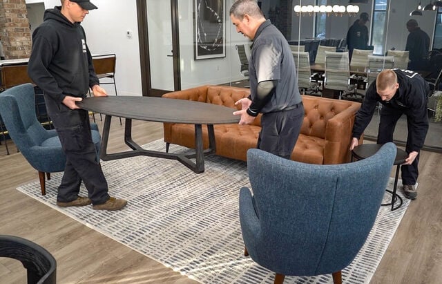 NFM Employees Moving Putting Furniture Back In Place After Flooring Install