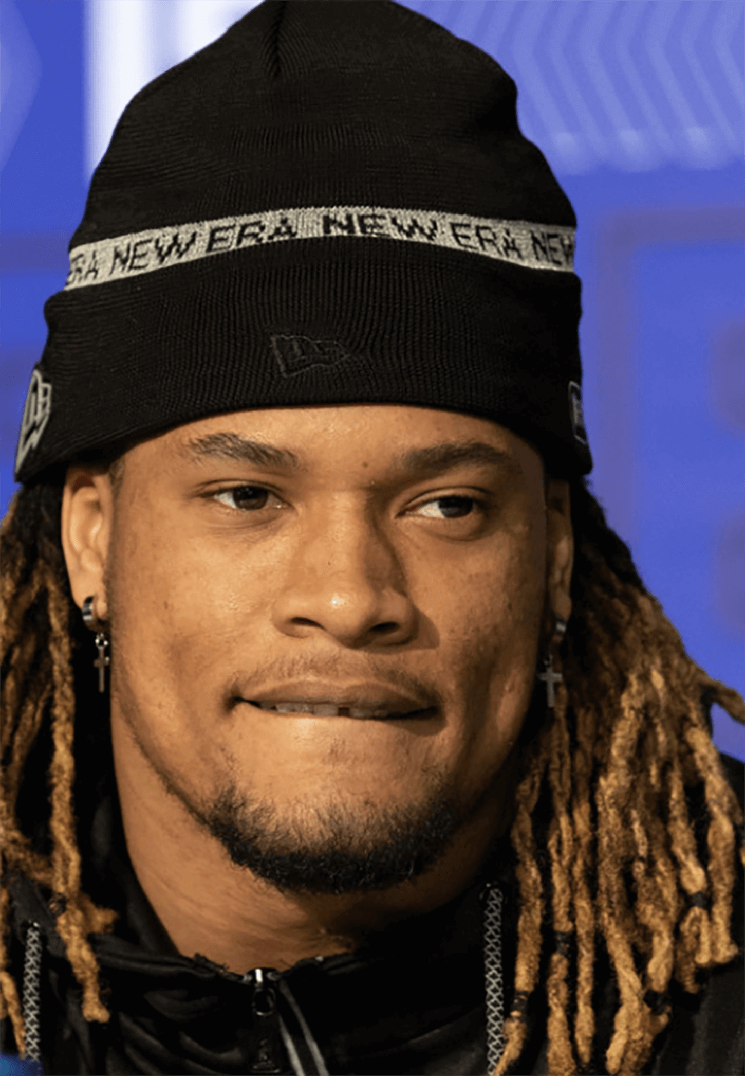 A headshot of Bryan Cook looking fierce in a hat.