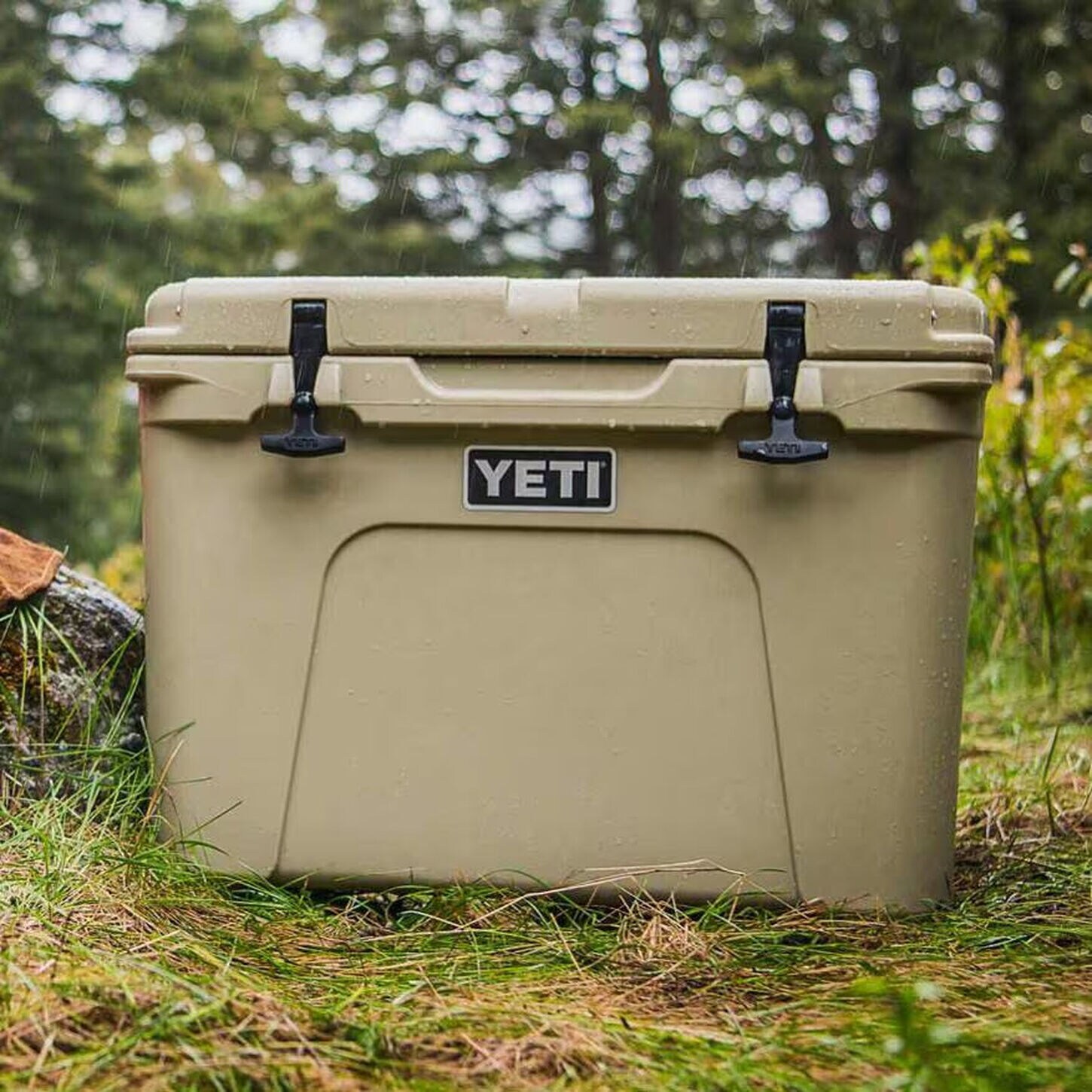 Brown Yeti cooler sitting out on a rainy day