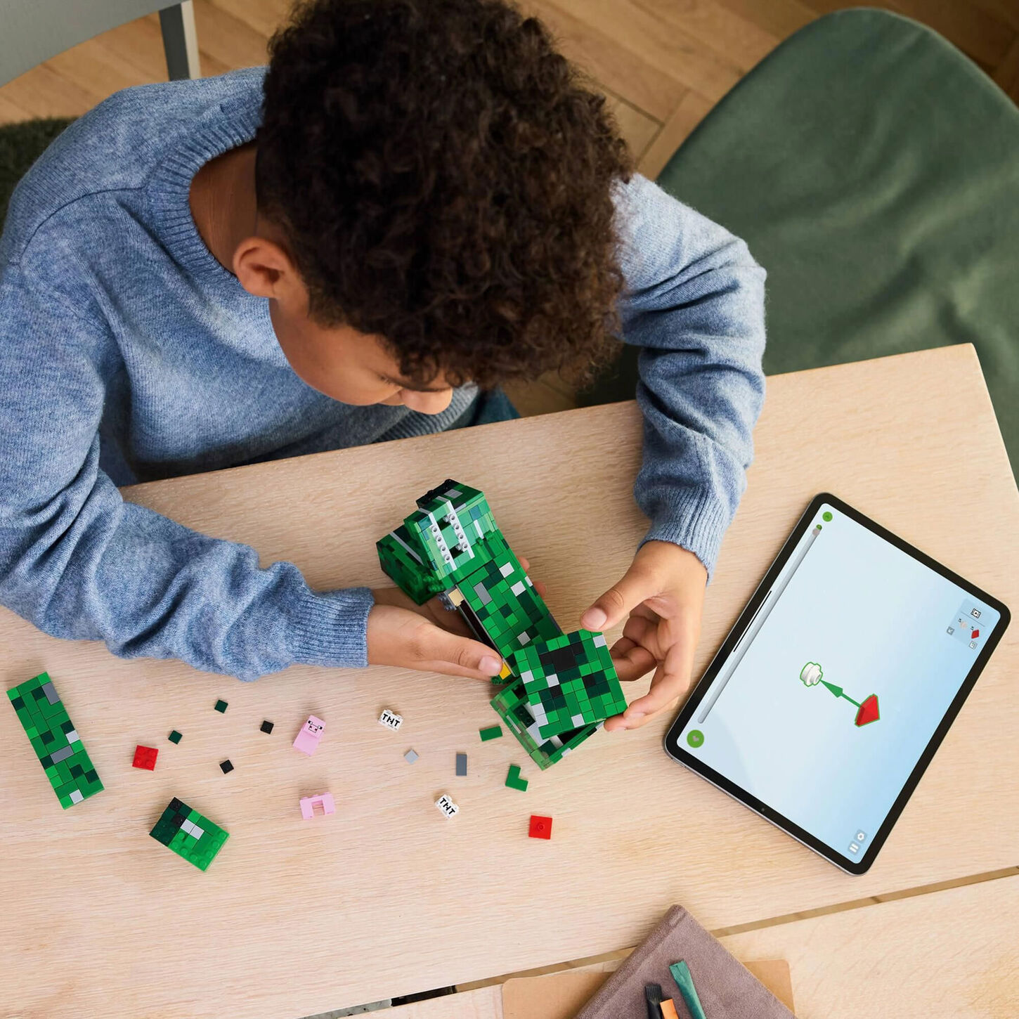 Child playing with minecraft lego.