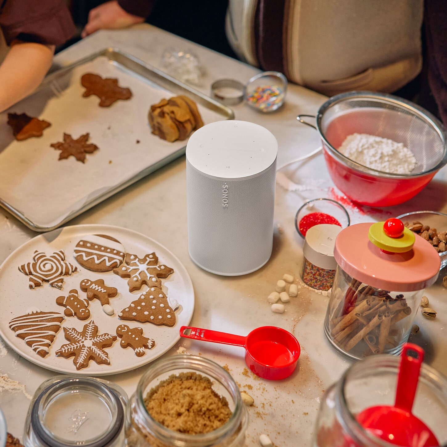 SONOS Wireless speaker in Soft White surrounded by christmas cookies