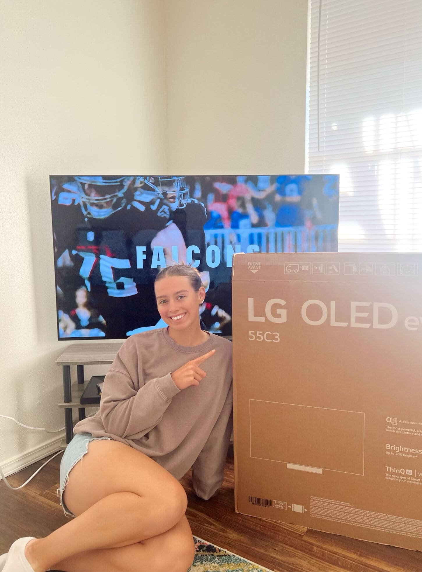 Home Team athlete posing for picture for welcome box