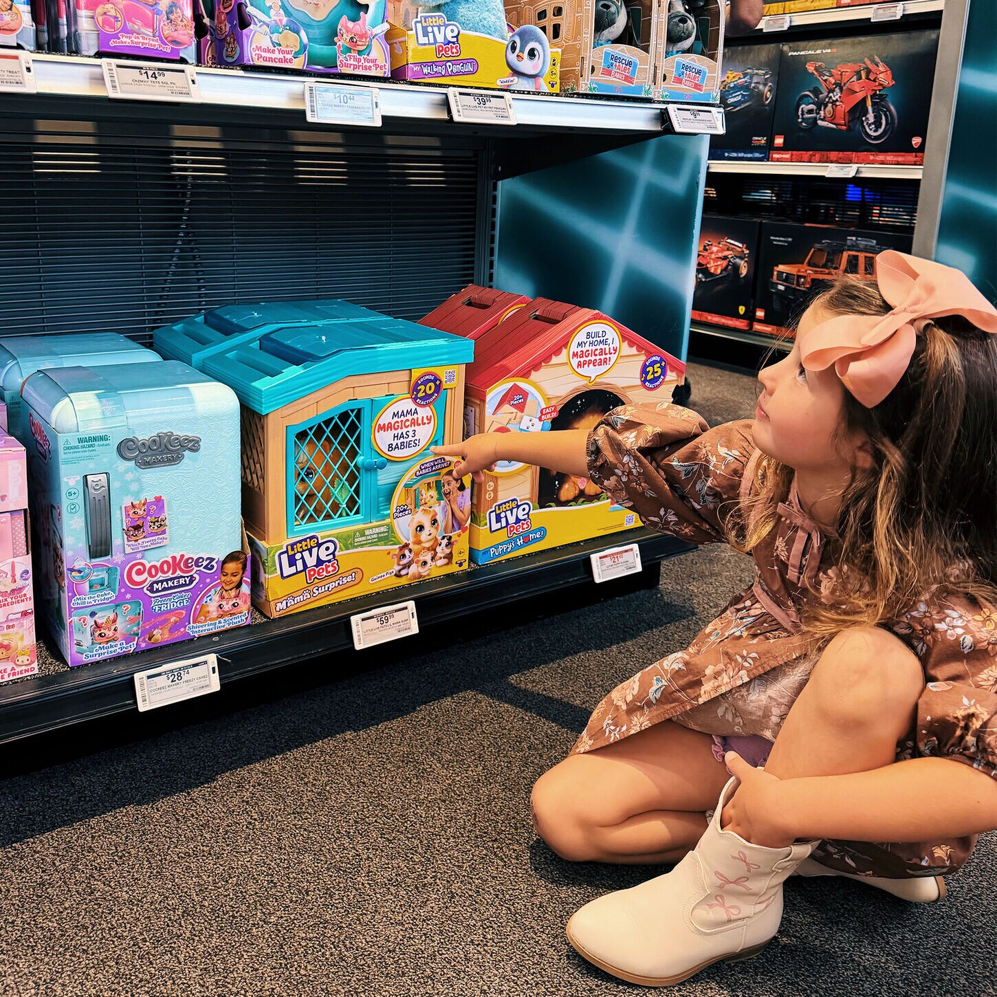 Hannah posing at nfm looking at toys