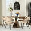 A stylish dining room with a table and chairs.