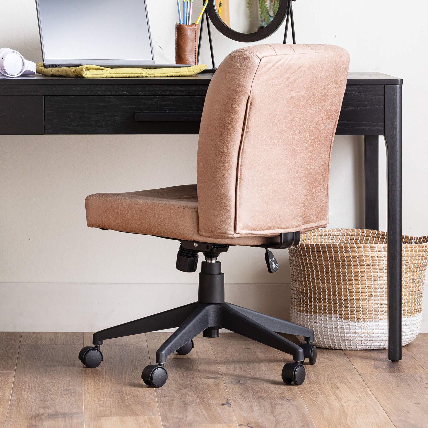 Brown office chair at the desk in a dorm room