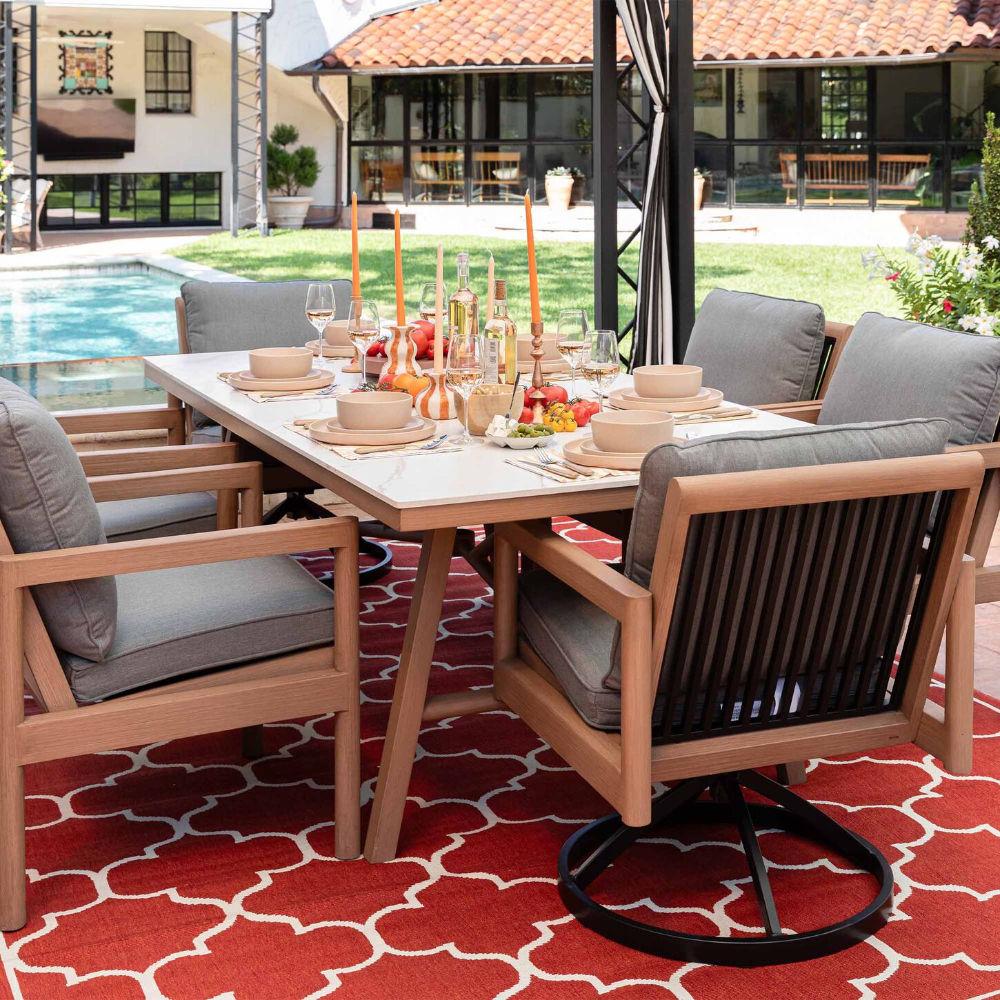 Brightly colored and decorated Patio Dining Set next to a pool