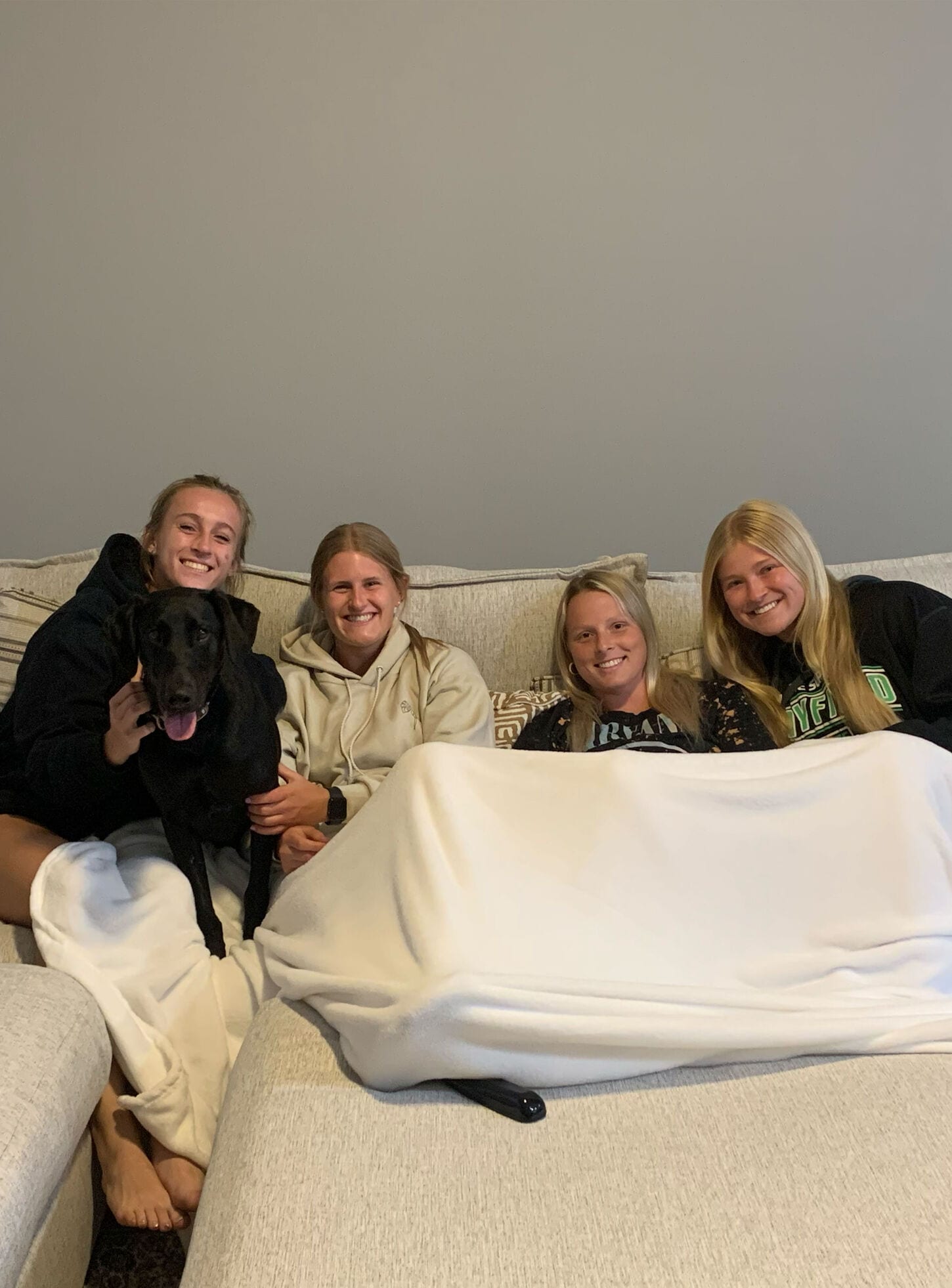 Home Team athlete posing for picture for welcome box