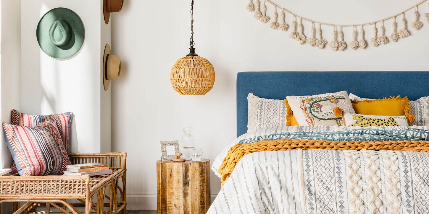 Hanging lamp near bed with colorful bedroom decor
