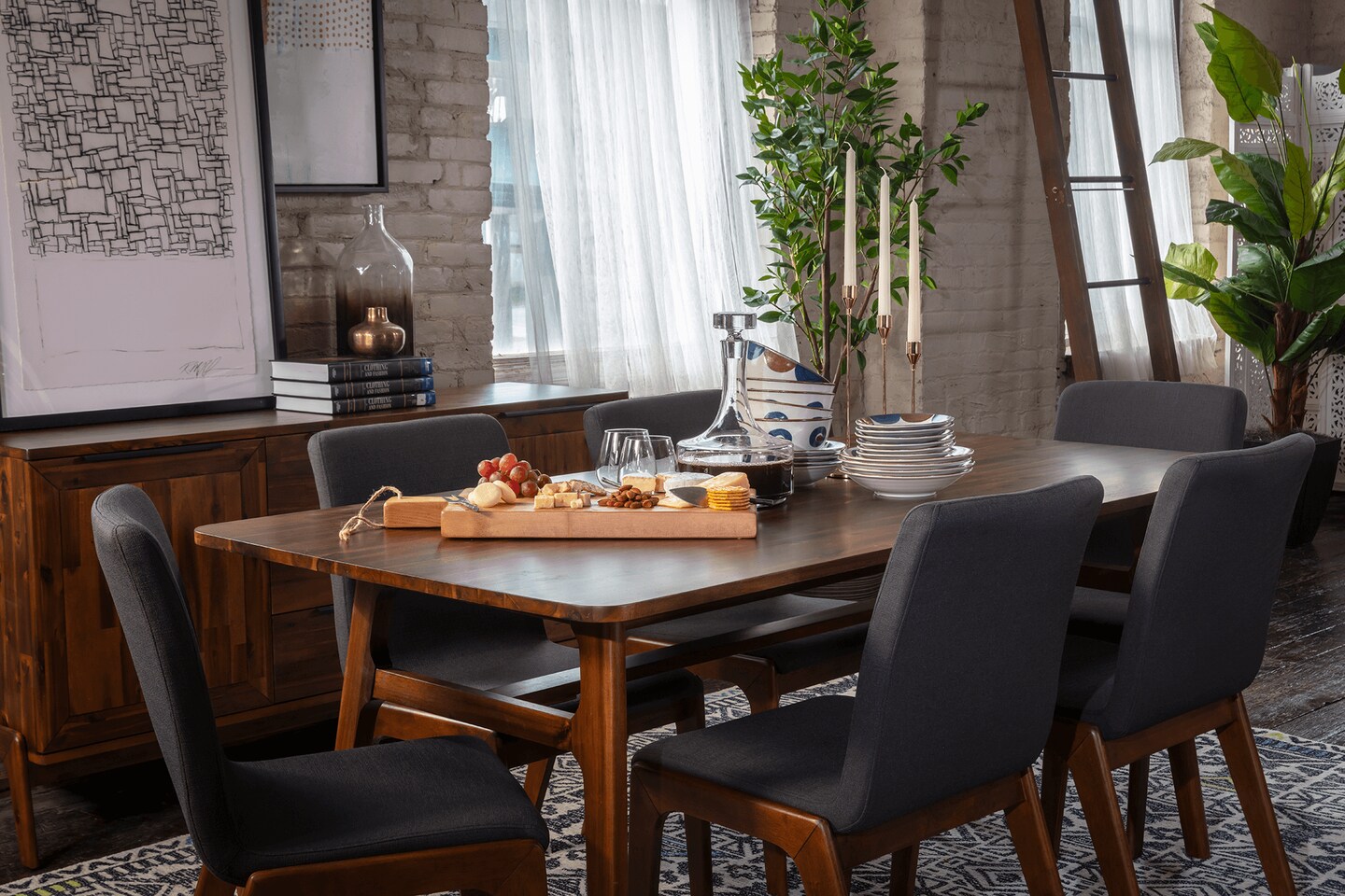 A nice dinner table that is mid-century modern design.