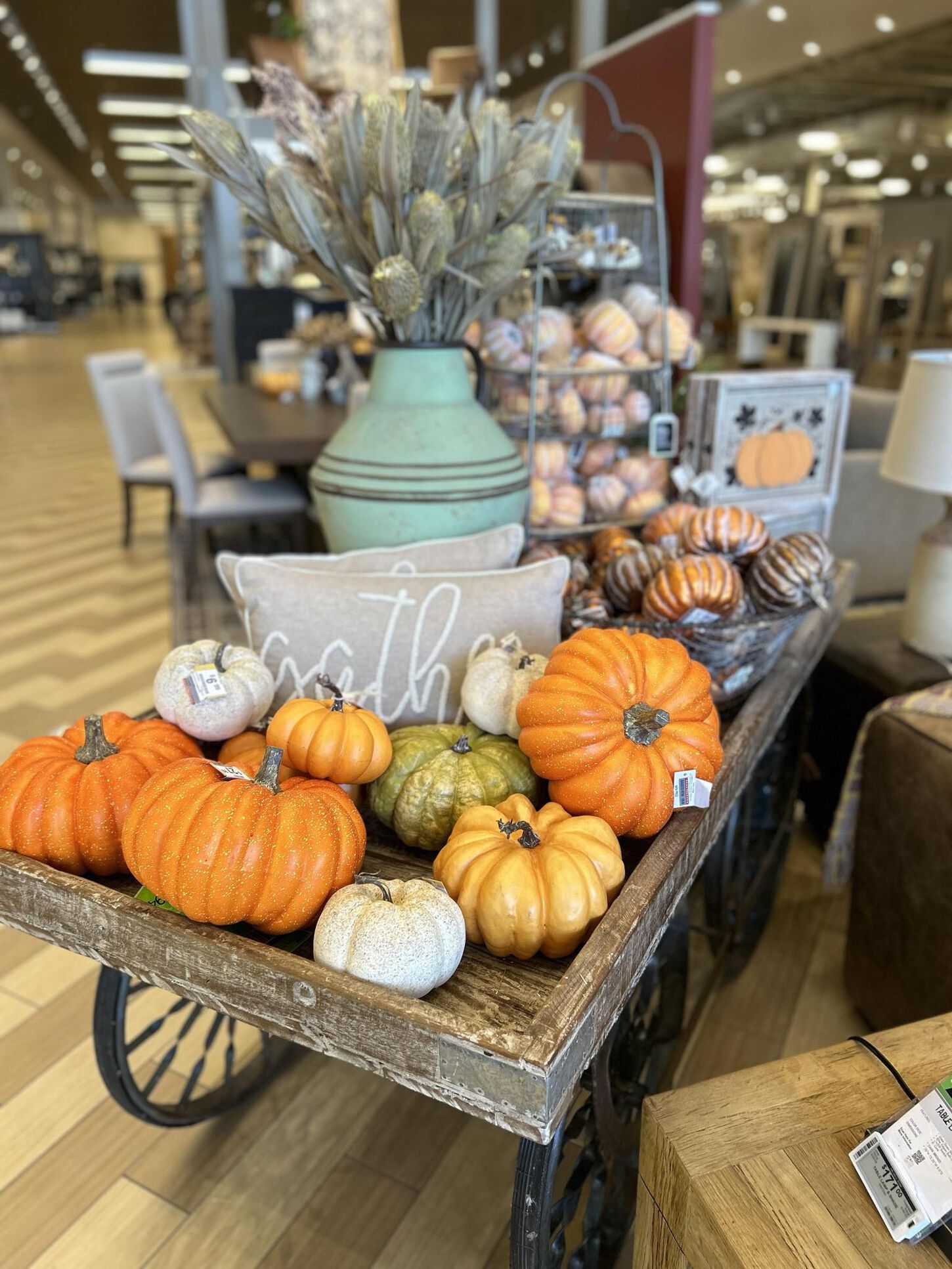 fall decor with pumpkins, pillows and table centerpieces 