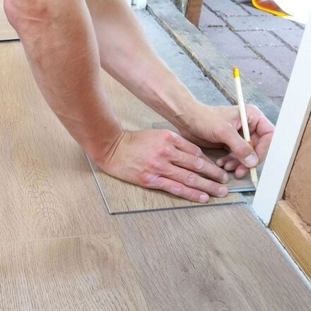 man installing floor
