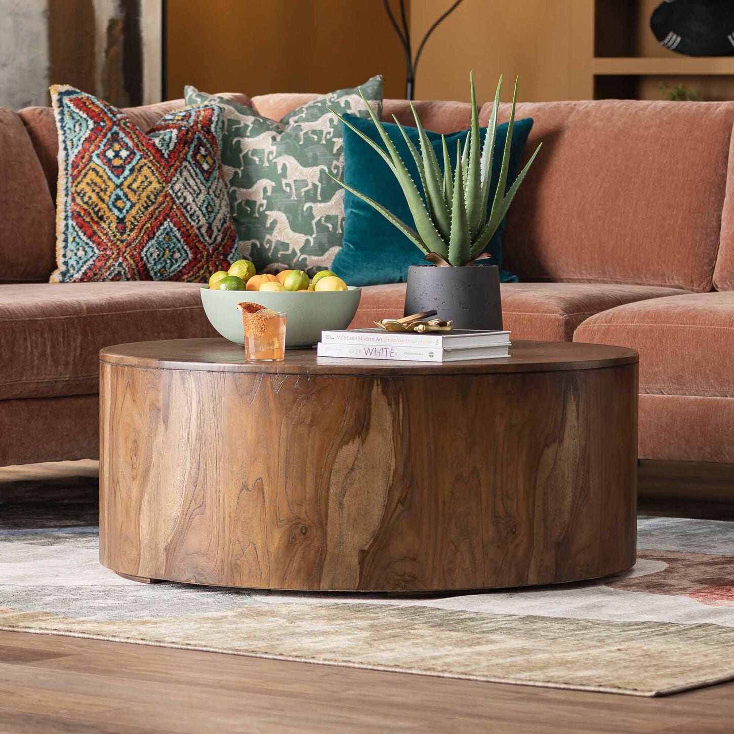 wood coffee table with orange sofa