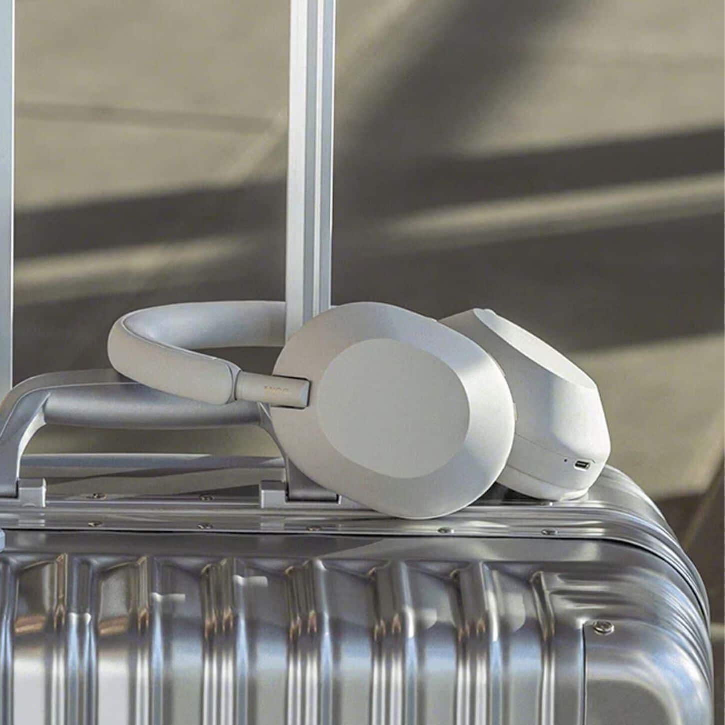 headphones on top of luggage