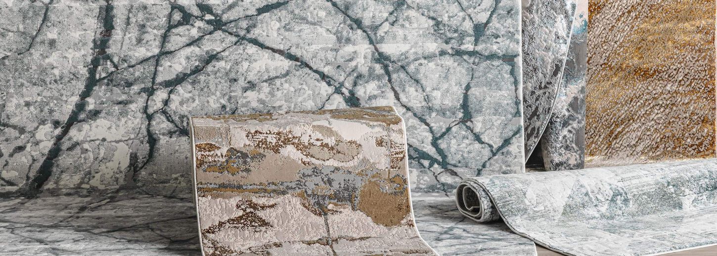 A collection of rugs of different colors and sizes