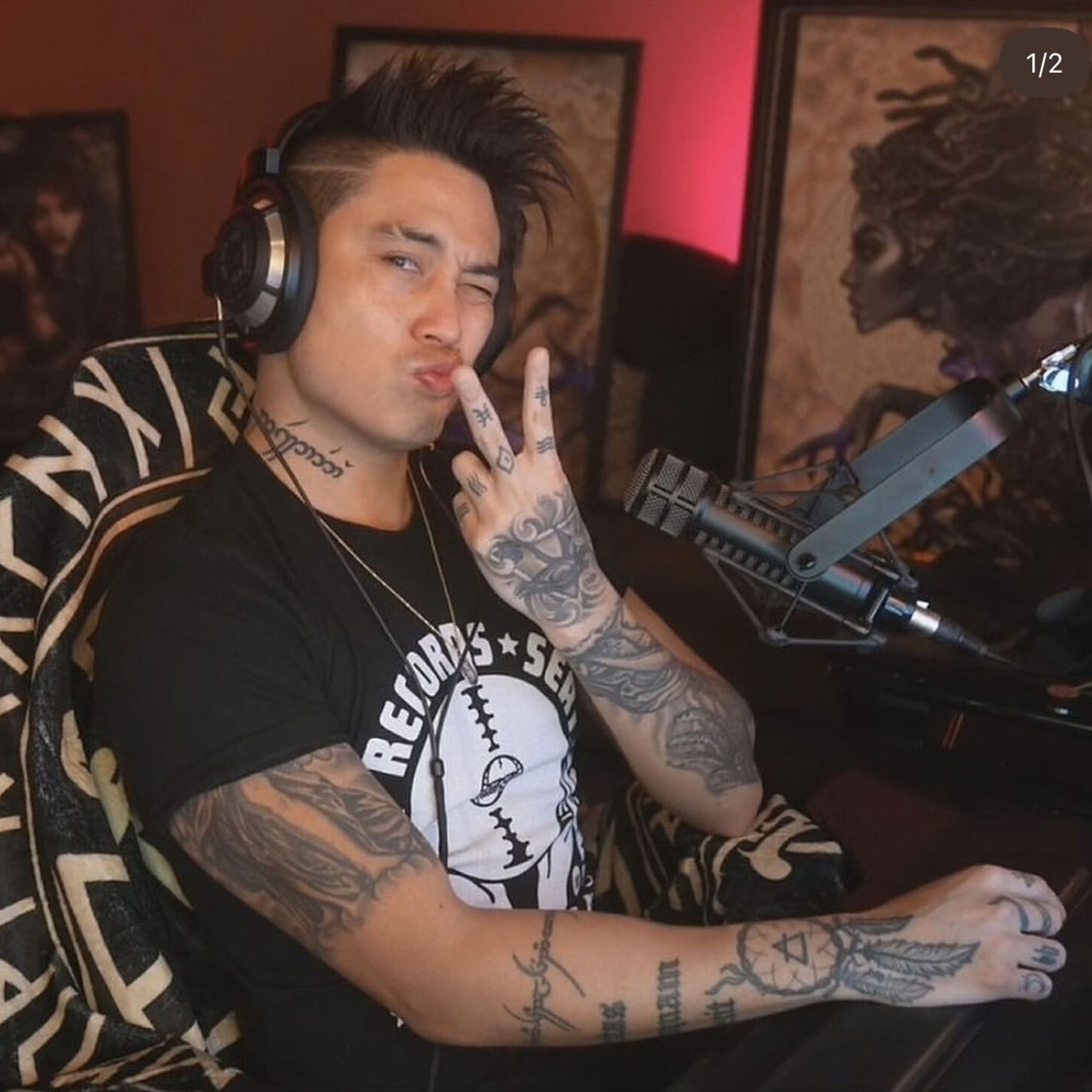 Influencer gamer Anthony Kongphan sitting in his game room posing for picture