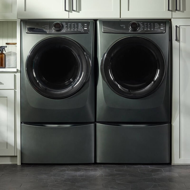 front load laundry pair side by side on pedestals in the color grey