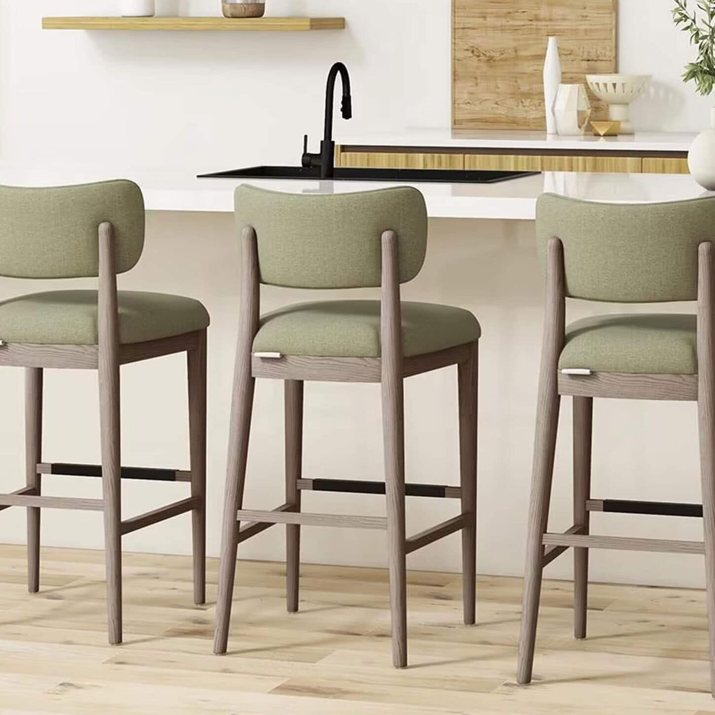 3 green bar stools in front of a kitchen island