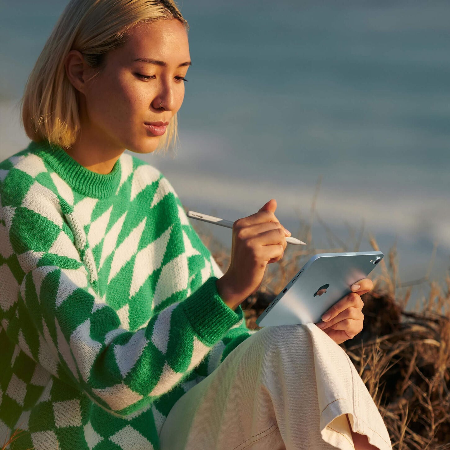 Person using Apple iPad outside