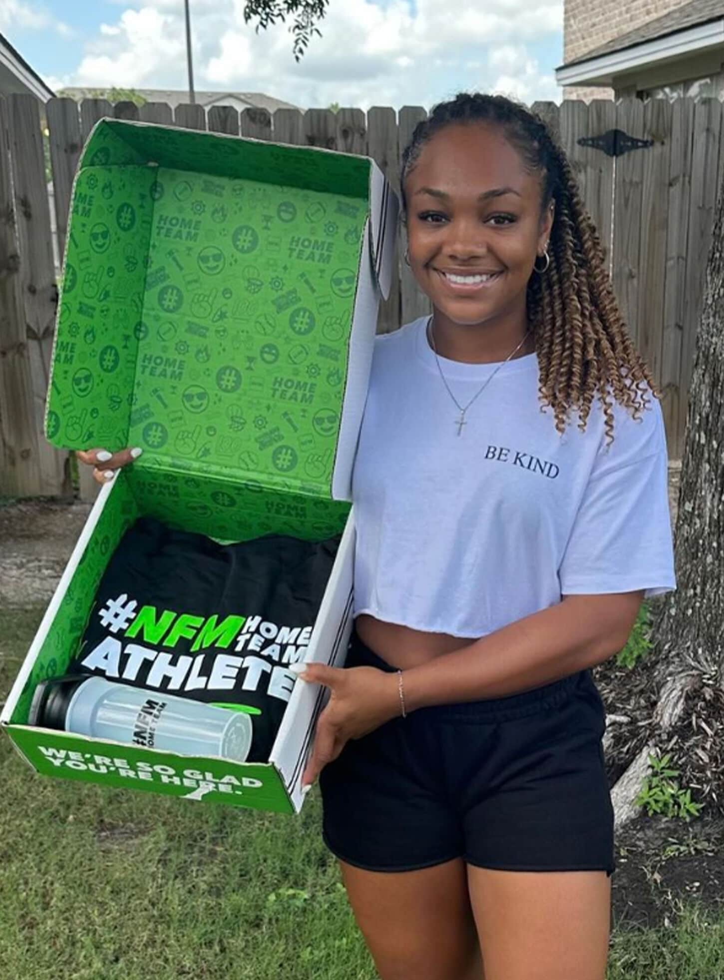 Home Team athlete posing for picture for welcome box