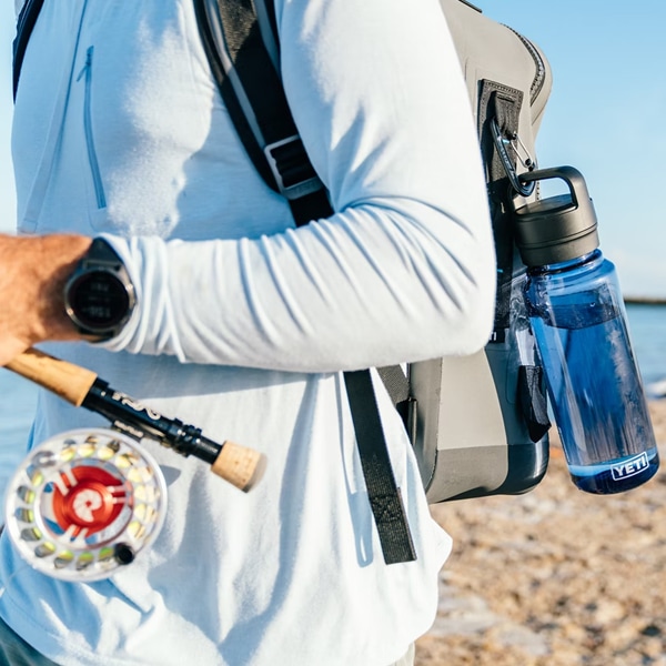 woman holding yeti drinkware