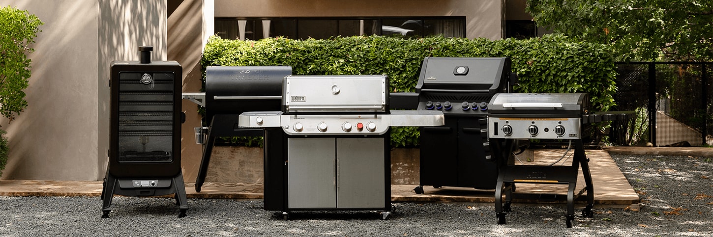 5 grills in a row in front of a large house