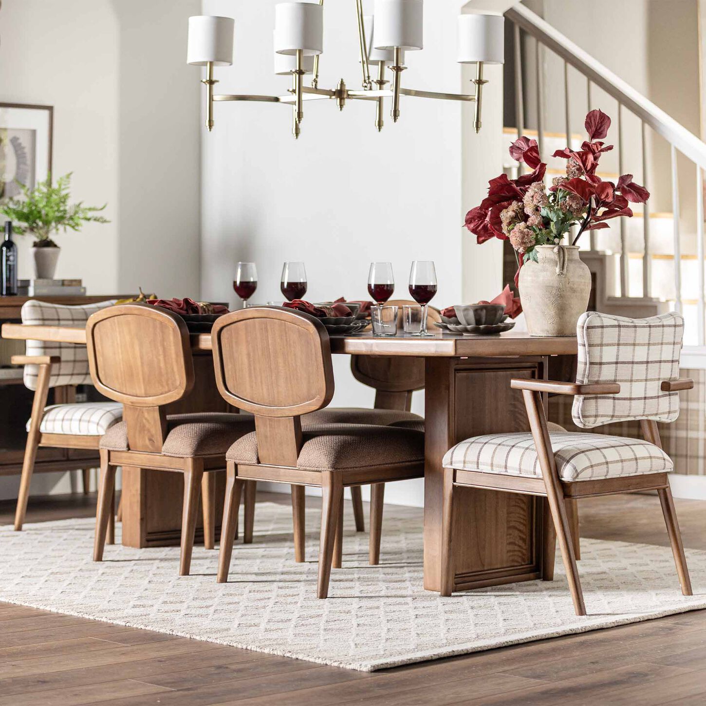 Fully set dining table in a bright dining room