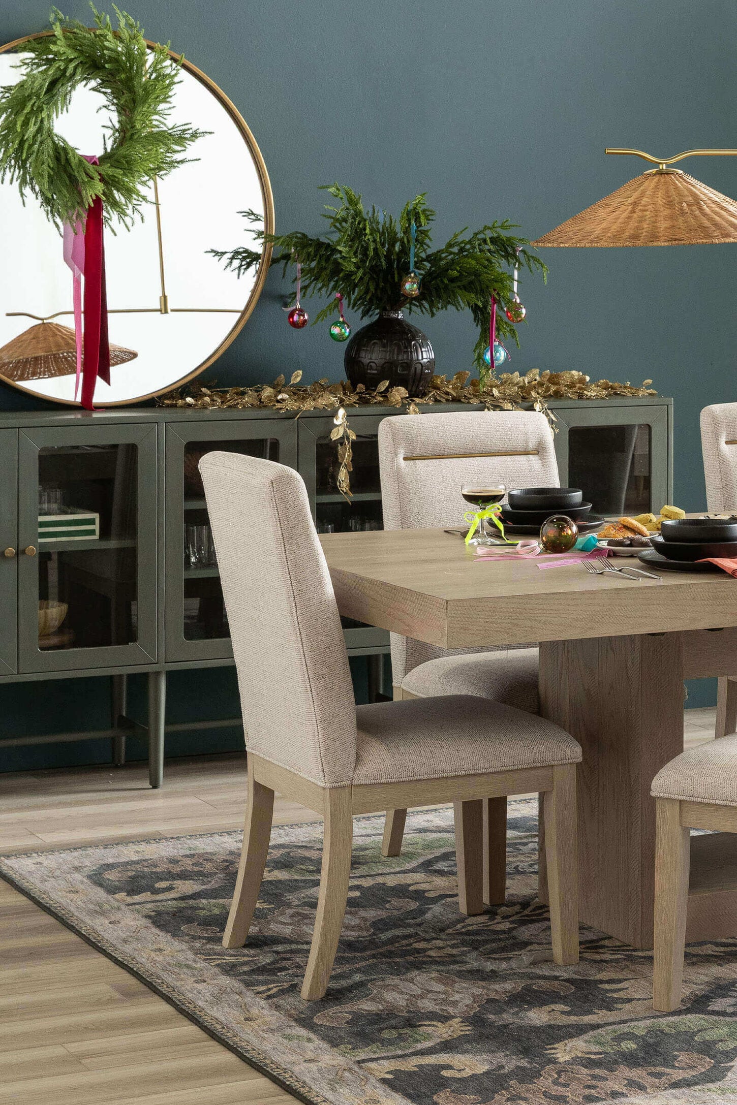 Dining room with a table, chairs, credenza and holiday decorations