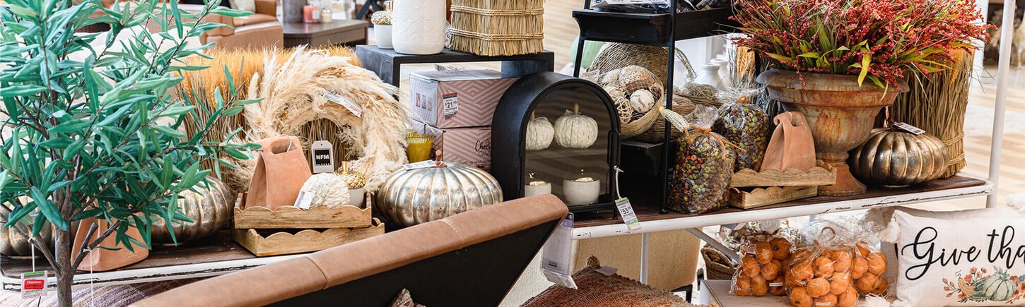 multiple home decor accessories with candles and plants