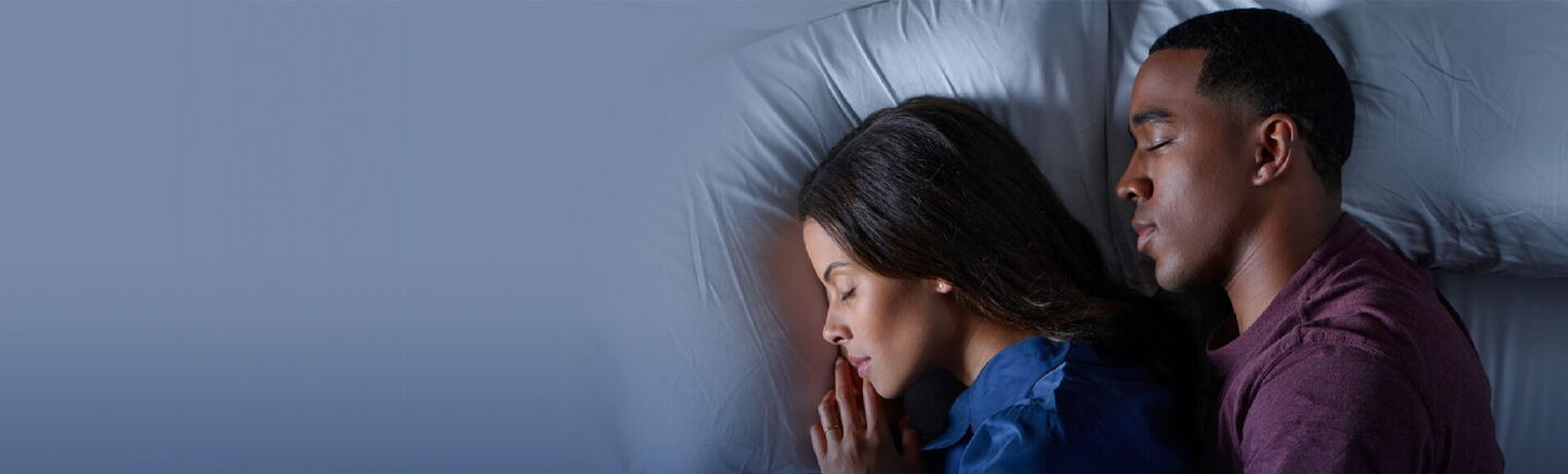 Couple Relaxing on a Tempur-Pedic Mattress