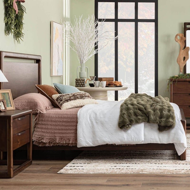 Bedroom scene with bed and nightstand
