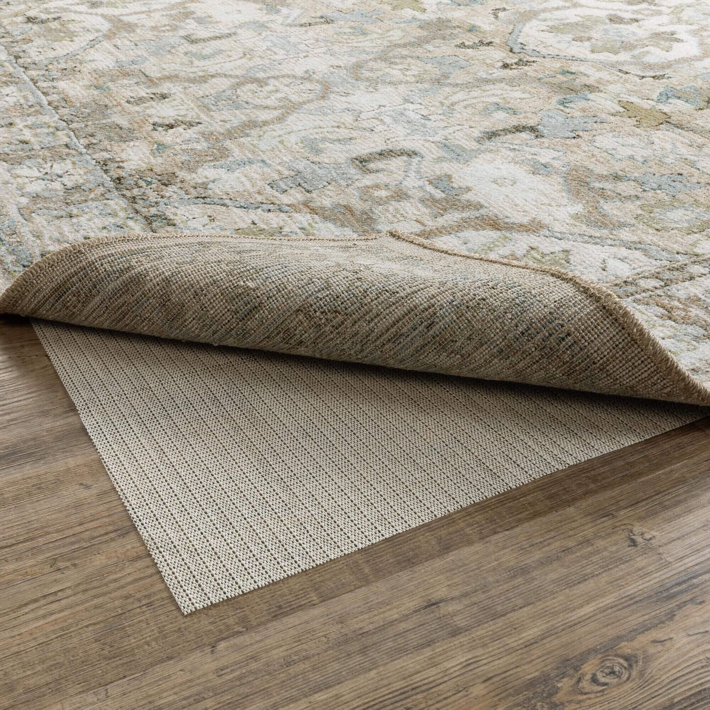 Oriental Weavers Sure Grip Beige 5'5" x 7'10" Rug Pad under a rug
