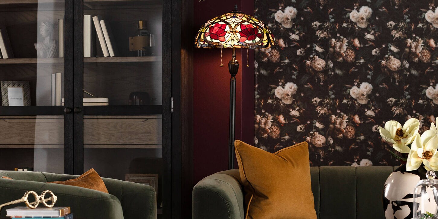 Tiffany inspired lamp in study with dark walls, dark decor and dark furniture colors