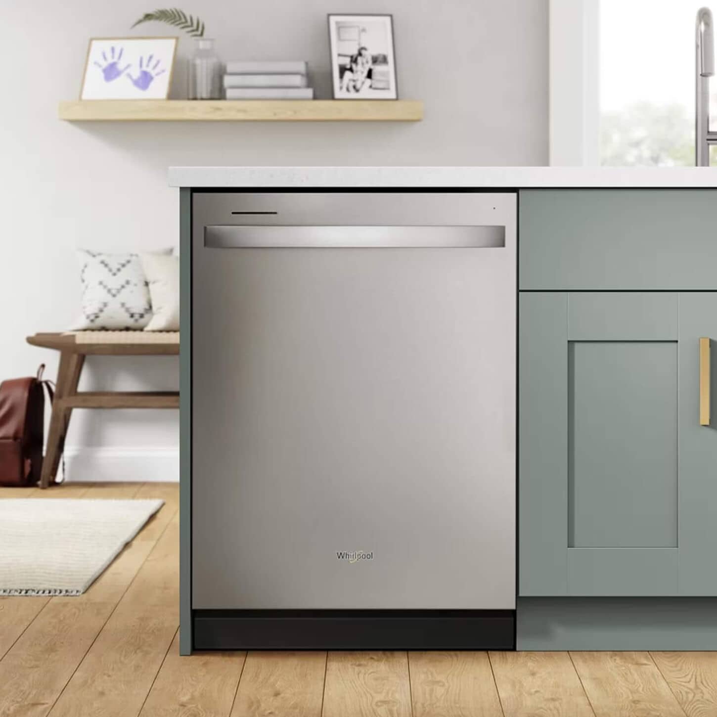 Whirlpol dishwasher in stainless steel in a kitchen with grey cabinets
