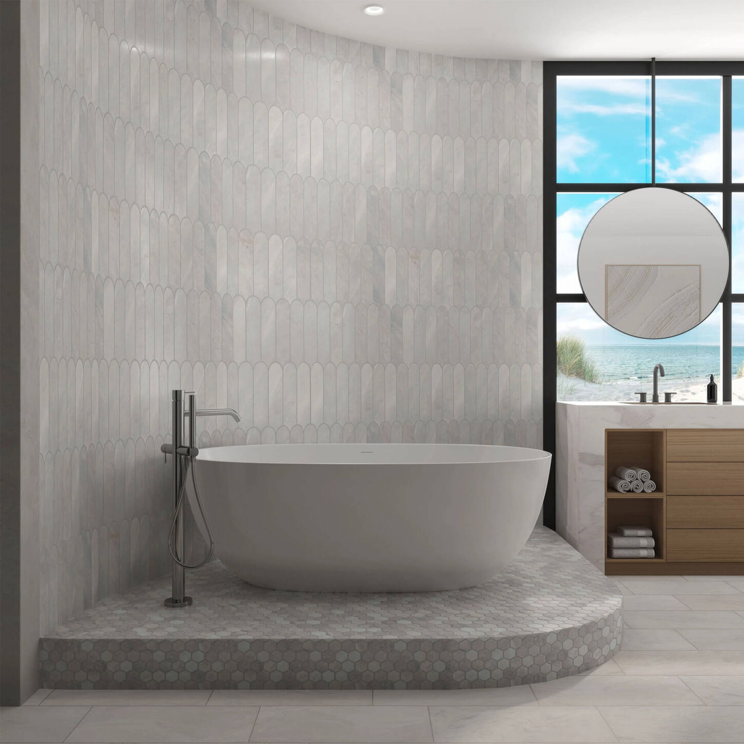 bathroom with a free standing bathtub on a raised section of floor in front of a curved tile wall