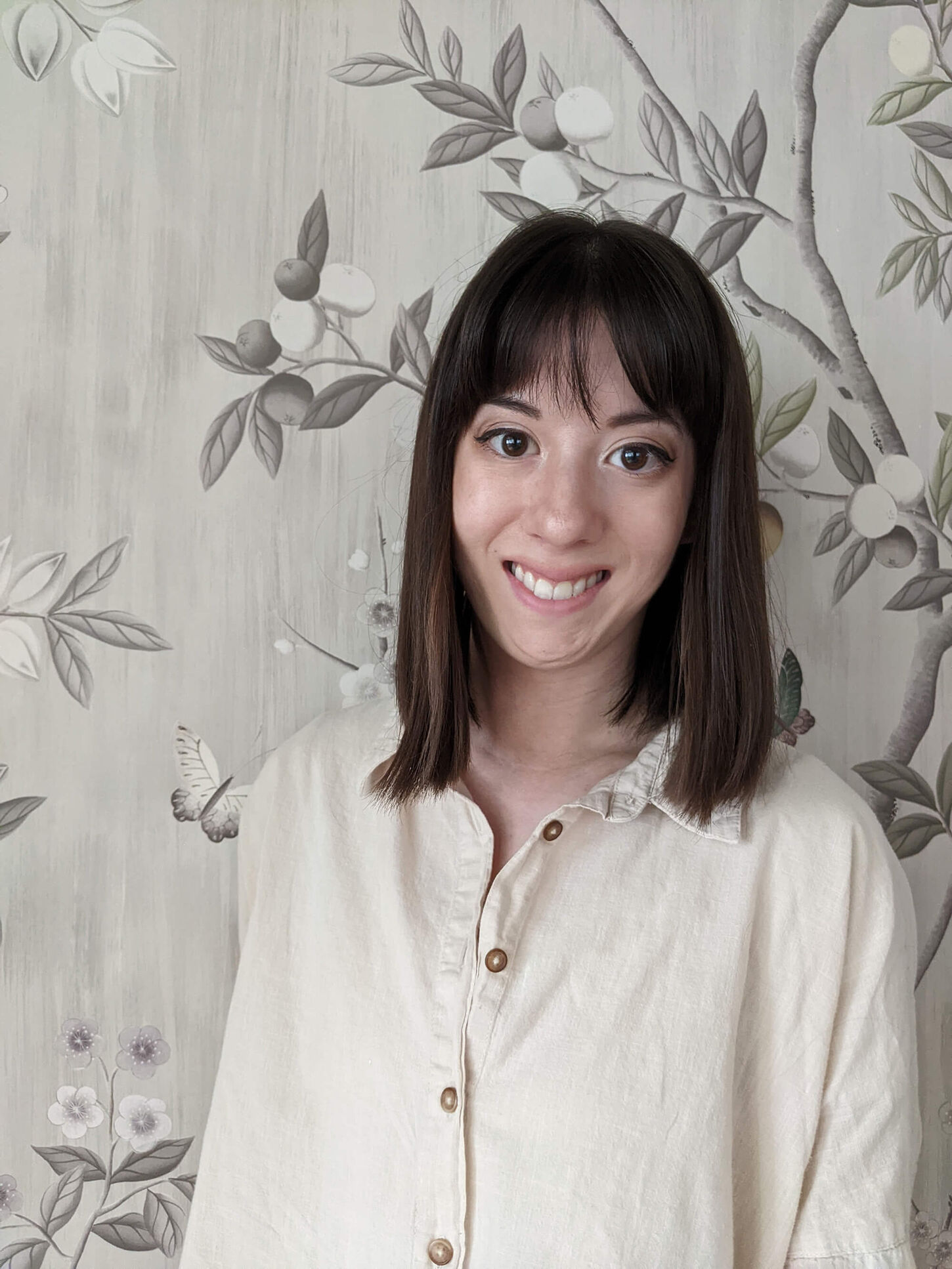 A headshot of Amanda Young y in a white button up 