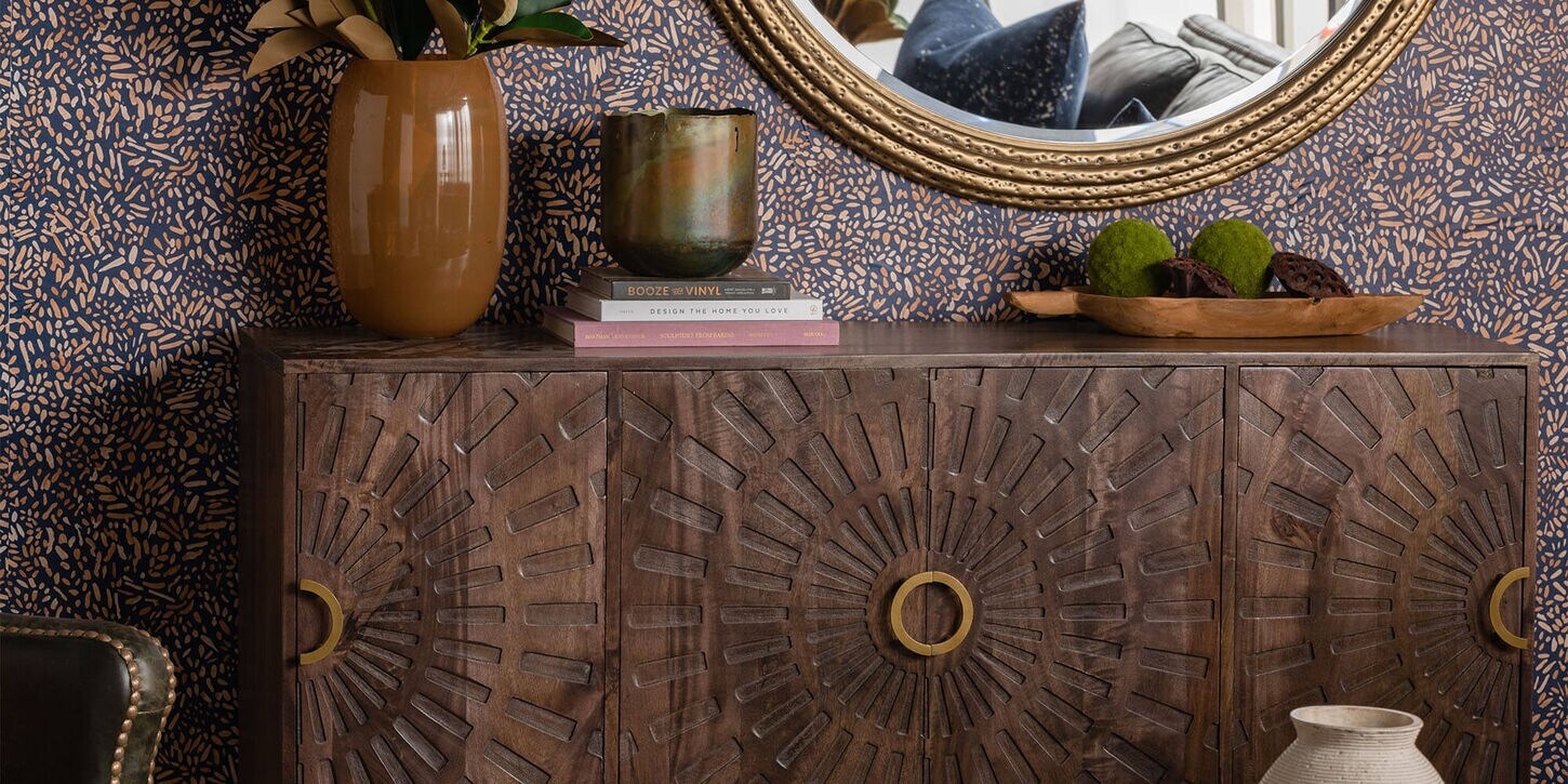 Credenza, vase, mirror, and home decor